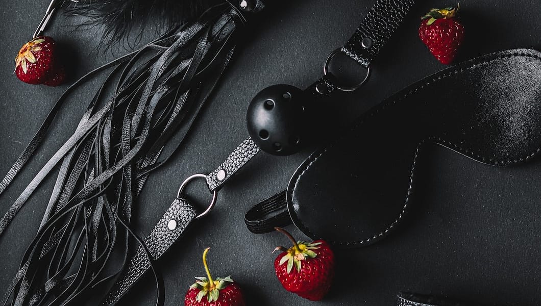 bdsm kink black accessories with strawberries