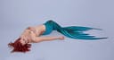 A topless sexy mermaid representing a paraplegic woman.